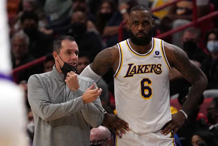 Los Angeles Lakers forward LeBron James next to coach Frank Vogel.